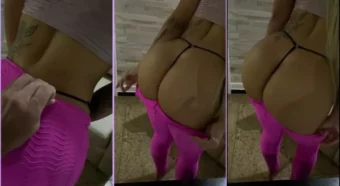 Luna Salvatori, com a bunda de fora e vestindo uma calça rosa bem colada