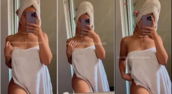 Menina latina gata de toalha se exibindo