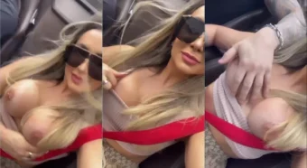 Menina liberando o motorista a dar uma pegadinha nas teta dela